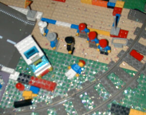Lego mini fig laying on the baseplate